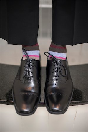 funny fashions - Close-up of men's dress shoes with striped socks, Canada Stock Photo - Rights-Managed, Code: 700-07232338