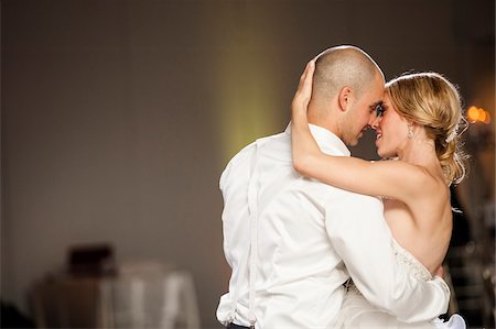 romantic couple indoors - Close-up of Bride and Groom dancing at Reception on Wedding Day, Canada Stock Photo - Rights-Managed, Code: 700-07232351