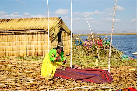 female native american clothing - Woman in Peruvian clothing displaying traditional art outdoors, Floating Island of Uros, Lake Titicaca, Peru Stock Photo - Rights-Managed, Code: 700-07529099