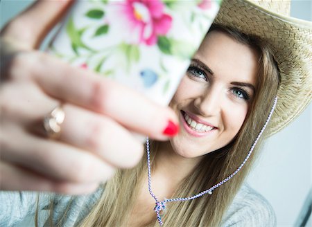 selfie - Young Woman taking Selfie, Studio Shot Stock Photo - Rights-Managed, Code: 700-07562381