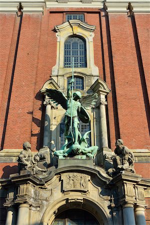 Close-up of statue of Archangel Michael over portal at St Michaelis Church, Hamburg, Germany Stock Photo - Rights-Managed, Code: 700-07599806