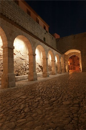 simsearch:855-08420585,k - Arches in Patio de Armas, City wall, Rampart, Dalt Vila, historic old town, Ibiza, Balearic Islands, Spain, Mediterranean, Europe Stock Photo - Rights-Managed, Code: 700-07698568
