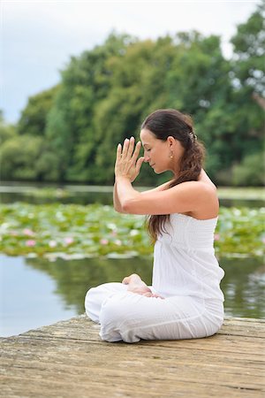 full lotus - Mature Woman doing Yoga in Park in Summer, Bavaria, Germany Stock Photo - Rights-Managed, Code: 700-07707652