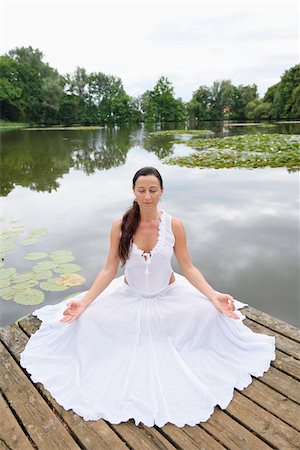 Mature Woman doing Yoga in Park in Summer, Bavaria, Germany Stock Photo - Rights-Managed, Code: 700-07707662
