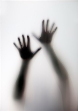 spooky - Blurred Hands and Arms through Frosted Glass Stock Photo - Rights-Managed, Code: 700-07729952