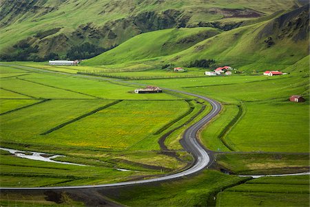 Scenic overview of farmland with winding road in spring, Vik, Iceland Stockbilder - Lizenzpflichtiges, Bildnummer: 700-07760028