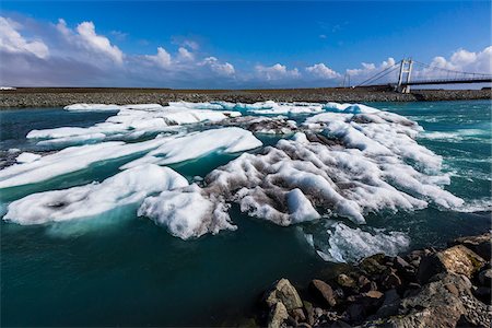 Scenic view of ice and glacial lake water with Glacial River Bridge in background, Jokulsarlon, Iceland Stock Photo - Rights-Managed, Code: 700-07760052