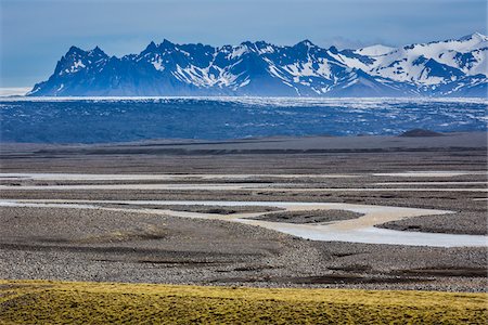 simsearch:700-07745169,k - Scenic view of Skeidararsandur and stream with mountains in the background, Nupsvotn, Iceland Stock Photo - Rights-Managed, Code: 700-07760118