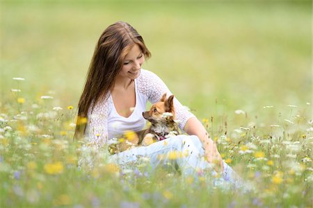 simsearch:700-08080570,k - Close-up of a young woman with her chihuahua dog in a flower meadow in summer, Upper Palatinate, Bavaria, Germany Stock Photo - Rights-Managed, Code: 700-07760210