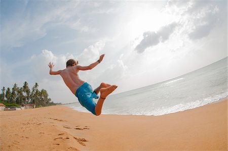 Boy Jumping in Air, Negombo Beach, Negombo, Western Province, Sri Lanka Stock Photo - Rights-Managed, Code: 700-07784170