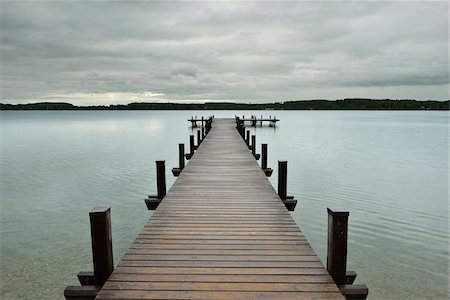 Wooden jetty on Lake Worthsee, Fuenfseenland, Upper Bavaria, Germany Stock Photo - Rights-Managed, Code: 700-07784581
