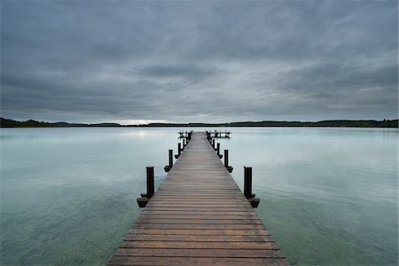 Wooden jetty on Lake Worthsee, Fuenfseenland, Upper Bavaria, Germany Stock Photo - Rights-Managed, Code: 700-07784582