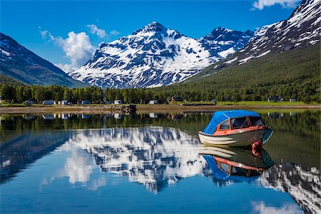 Scenic view of boat on lake and mountains in background, Ramfjord, Tromsoe, Troms, Northern Norway, Norway Stock Photo - Rights-Managed, Code: 700-07849690