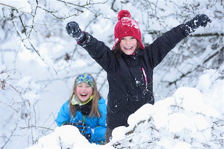 frolicking - Portrait of two girls playing in the snow, winter, Bavaria, Germany Stock Photo - Rights-Managed, Code: 700-07991774