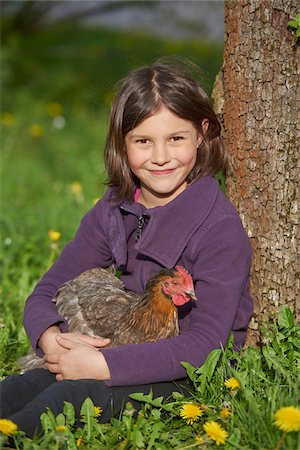 simsearch:700-03615826,k - Portrait of Happy Girl with Chicken (Gallus gallus domesticus) Sitting in Meadow in Spring, Upper Palatinate, Bavaria, Germany Stock Photo - Rights-Managed, Code: 700-08059863