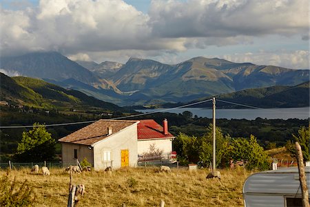 farmyard - View of House with Sheep Grazing at Lake Campotosto with Mountains in background, Monti della Laga, Gran Sasso and Monti della Laga National Park, Abruzzo, Italy Stock Photo - Rights-Managed, Code: 700-08083002