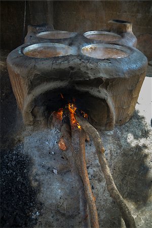 Close-up of home made beer in vats over fire, Gaoua, Poni Province, Burkina Faso Stock Photo - Rights-Managed, Code: 700-08169175
