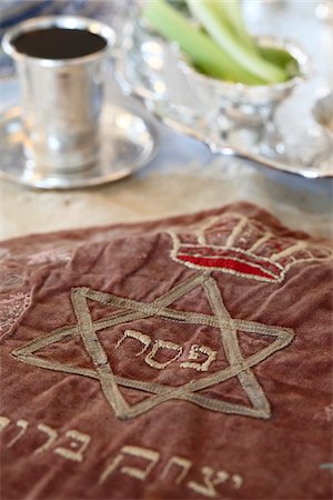 passover table setting - Close-up of Matzah Cover with Wine Cup in Passover Seder Table Setting Stock Photo - Rights-Managed, Code: 700-08274215