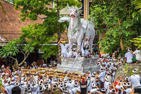 simsearch:700-00153579,k - People carrying a raised, white bull character in a parade at a cremation ceremony for a high priest in Ubud, Bali, Indonesia Stock Photo - Rights-Managed, Code: 700-08385899