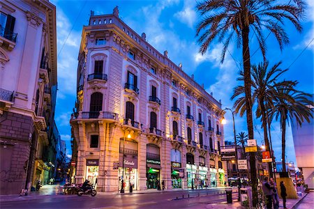 Ornate architecture along Via Roma in the shopping district at dusk, in the historic city of Palermo in Sicily, Italy Stock Photo - Rights-Managed, Code: 700-08701935