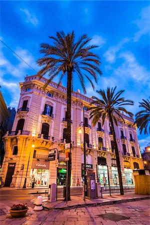 simsearch:700-03622861,k - Ornate architecture and street corner along Via Roma in the shopping district at dusk, in the historic city of Palermo in Sicily, Italy Stock Photo - Rights-Managed, Code: 700-08701936