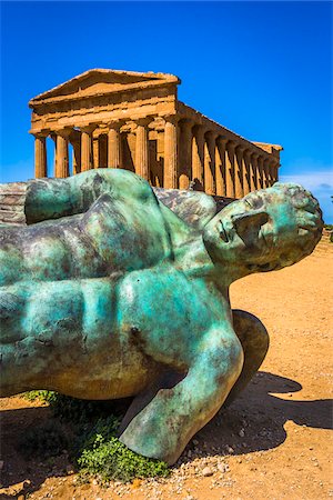 ruin - Fallen Icarus Sculpture by Igor Mitoraj in front of Temple of Concordia at Valle dei Templi in Ancient Greek City at Agrigento, Sicily, Italy Stock Photo - Rights-Managed, Code: 700-08702035