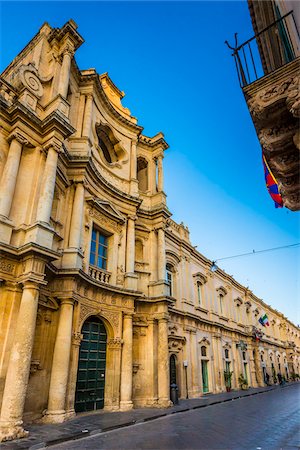 simsearch:855-08420585,k - Street view of the Church of Montevergine (Chiesa di Montevergine) against a blue sky in Noto in the Province of Syracuse in Sicily, Italy Stock Photo - Rights-Managed, Code: 700-08723174