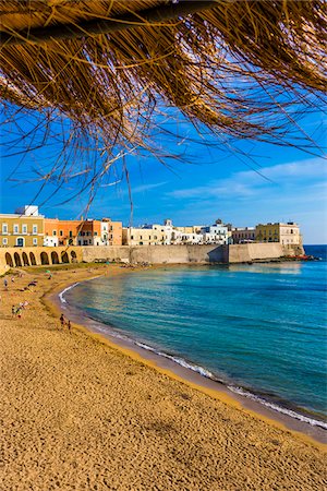 simsearch:841-05783557,k - View of the coastal Old Town of Gallipoli from under a straw sun umbrella in Puglia, Italy Stock Photo - Rights-Managed, Code: 700-08739623