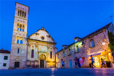 simsearch:400-04015133,k - Children playing in St Stephen's Square at night holding Croatian national flag at dusk with Cathedral of St Stephen in Old Town of Hvar on Hvar Island, Croatia Stock Photo - Rights-Managed, Code: 700-08765415