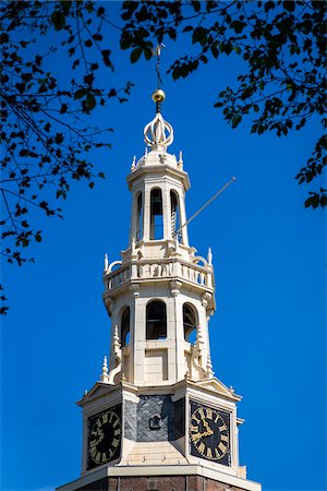 simsearch:700-03698221,k - Top section of the Montelbaanstoren tower along the Oudeschans Canal in Amsterdam, Holland Stock Photo - Rights-Managed, Code: 700-08973517