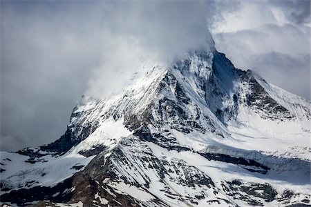 pennine alps - Mountain mist partially covering the Matterhorn summit at Zermatt in Switzerland Stock Photo - Rights-Managed, Code: 700-08986344
