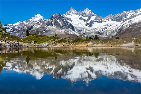pennine alps - The Swiss Alps reflected in the small mountain lake of Grunsee at Zermatt, Switzerland Stock Photo - Rights-Managed, Code: 700-08986354