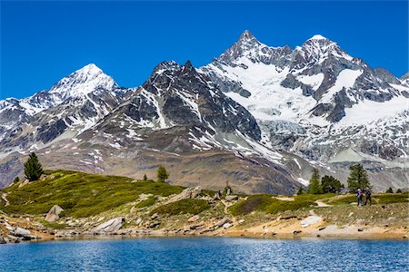 simsearch:600-03907131,k - People hiking along the shore of the small mountain lake Grunsee with mountain tops of the Swiss Alps in the background at Zermatt, Switzerland Stock Photo - Rights-Managed, Code: 700-08986353