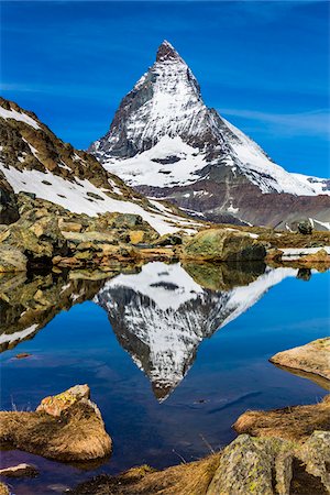 pennine alps - The Matterhorn reflected in a lake near Riffelsee at Zermatt, Switzerland Stock Photo - Rights-Managed, Code: 700-08986376