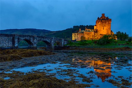simsearch:700-04003402,k - Eilean Donan Castle illuminated at dusk near Kyle of Lochalsh in Scotland, United Kingdom Stock Photo - Rights-Managed, Code: 700-08986529