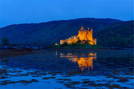 simsearch:700-04003402,k - Eilean Donan Castle illuminated at dusk near Kyle of Lochalsh in Scotland, United Kingdom Stock Photo - Rights-Managed, Code: 700-08986530
