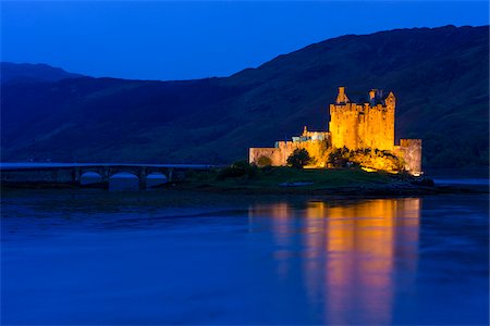 simsearch:700-04003402,k - Eilean Donan Castle illuminated at dusk near Kyle of Lochalsh in Scotland, United Kingdom Stock Photo - Rights-Managed, Code: 700-08986532