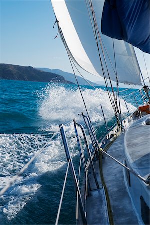 sailboats water nobody - Waves splashing against sailboat while sailing around the Whitsunday Islands in Queensland, Australia Stock Photo - Rights-Managed, Code: 700-09025290