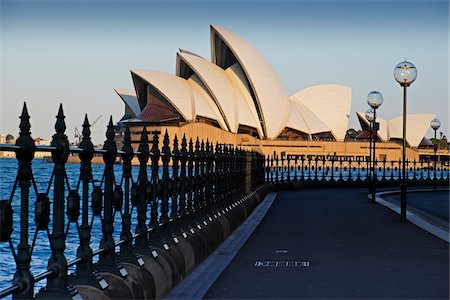 street and low angle - Railing and seawall with paved road leading to the Sydney Opera House in Sydney, Australia Stock Photo - Rights-Managed, Code: 700-09022598