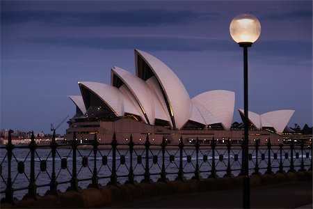 playhouse - Railing and seawall with a lamp post illuminated in front of the Sydney Opera House at dawn in Sydney, Australia Stock Photo - Rights-Managed, Code: 700-09022599