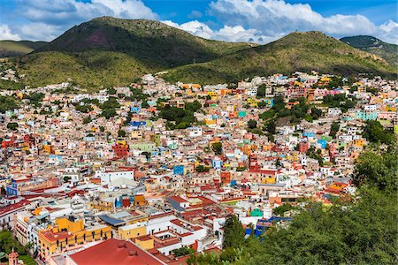 Scenic overview of Guanajuato City with multi-colored houses on the hills surrounding the city, Guanajuato State, Mexico Stock Photo - Rights-Managed, Code: 700-09071062