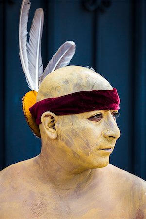 simsearch:614-02679643,k - Close-up portrait of a male, indigenous tribal dancer with painted skin and feathered headband at the St Michael Archangel Festival parade in San Miguel de Allende, Mexico Stock Photo - Rights-Managed, Code: 700-09088055