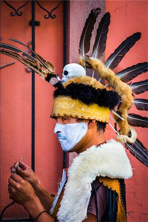 simsearch:614-02679643,k - Close-up portrait of a male, indigenous tribal dancer wearing feathered headdress at the St Michael Archangel Festival parade in San Miguel de Allende, Mexico Stock Photo - Rights-Managed, Code: 700-09088061