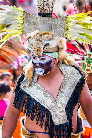 simsearch:614-02679643,k - Close-up portrait of a male, indigenous tribal dancer wearing a costume in the St Michael Archangel Festival parade in San Miguel de Allende, Mexico Stock Photo - Rights-Managed, Code: 700-09088070