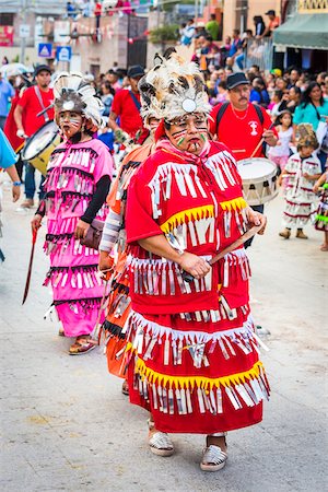 simsearch:614-02679643,k - Close-up of female, indigenous tribal dancers in colorful costumes in the St Michael Archangel Festival parade in San Miguel de Allende, Mexico Stock Photo - Rights-Managed, Code: 700-09088083