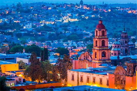 simsearch:400-04015133,k - The pink stone bell tower of the Oratorio de San Felipe Neri and overview of the city at dusk in San Miguel de Allende, Mexico Stock Photo - Rights-Managed, Code: 700-09088104