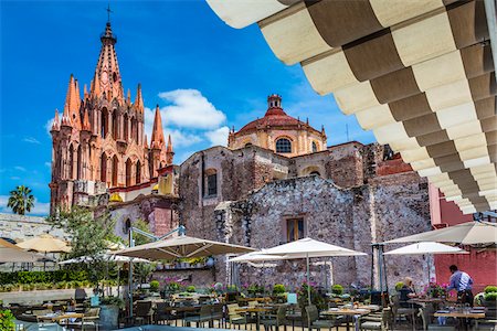 Rooftop terrace of the Quince Restaurant with the pink stone turrets of the Parroquia de San Miguel Arcangel in San Miguel de Allende, Mexico Stock Photo - Rights-Managed, Code: 700-09088107
