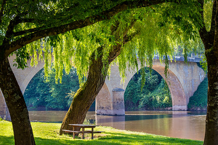 french country river photos - Relaxing sitting area along the Vezere River in the town of Limeuil in Dordogne, Nouvelle-Aquitaine, France Stock Photo - Rights-Managed, Code: 700-09236483