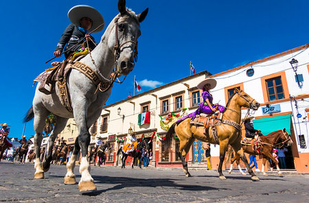 simsearch:700-02694234,k - Horseback riders in traditional costums on cobblestone street at the Mexican Independence Day Parade in San Miguel de Allende, Guanajuato, Mexico Stock Photo - Rights-Managed, Code: 700-09273210