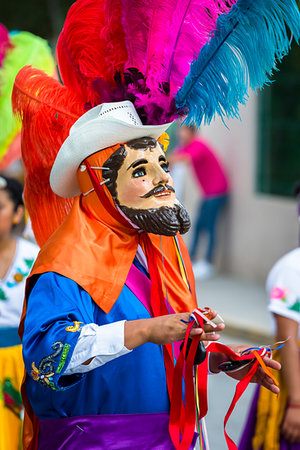 Man wearing colorful costume with cowboy hat and mask at a St Michael Archangel Festival parade in San Miguel de Allende, Mexico Photographie de stock - Rights-Managed, Code: 700-09273242